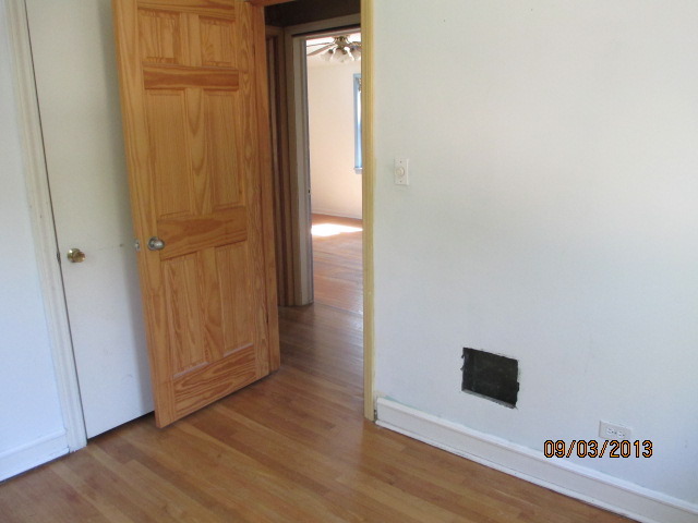 432 Harding Avenue Des Plaines, IL 60016 - Photo 19 of 20 a view of a hallway with wooden floor