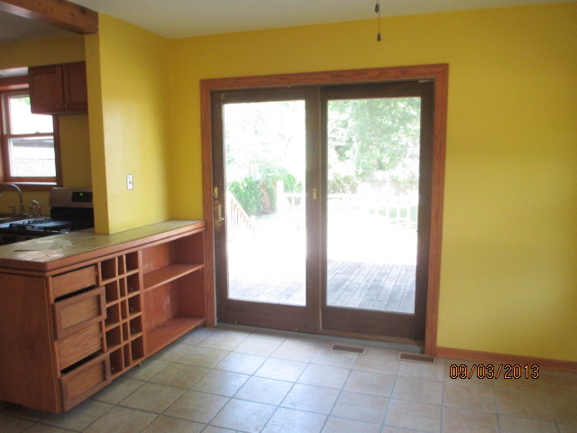 432 Harding Avenue Des Plaines, IL 60016 - Photo 7 of 20 a view of a kitchen with wooden floor and windows