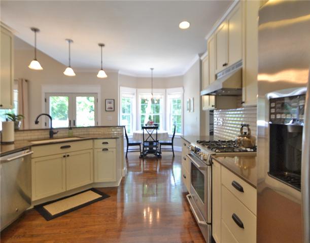 4257 Warren Road Franklin, TN 37067 - Photo 7 of 20 Fabulous . . . upgraded kitchen with almost new appliances . . . quartz countertops . . . subway tile backsplash . . .