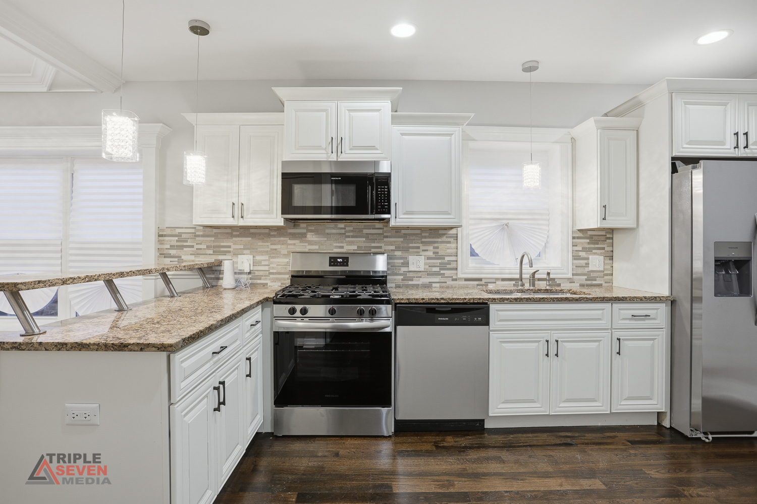 3832 West 64th Place Chicago, IL 60629 - Photo 15 of 35 a kitchen with granite countertop a sink stainless steel appliances and white cabinets
