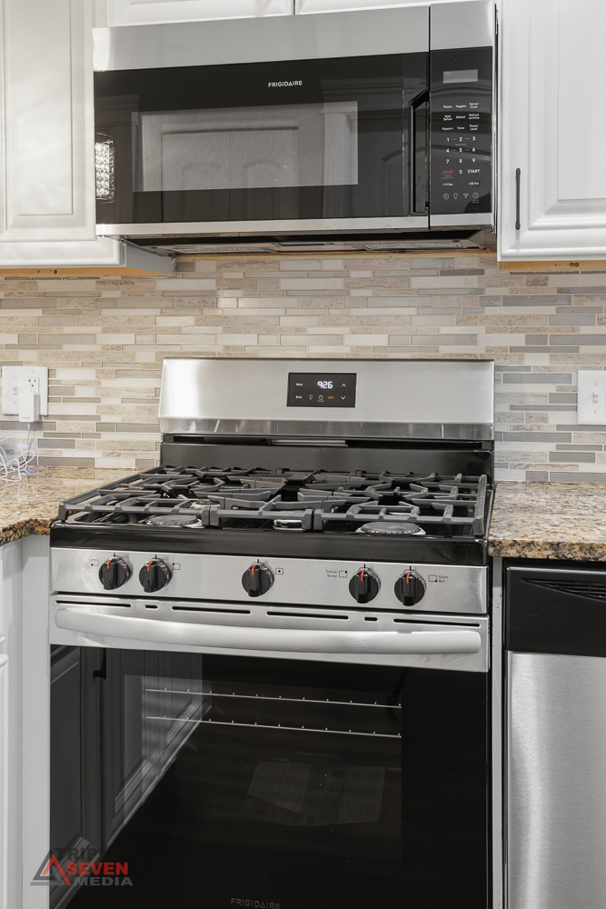 3832 West 64th Place Chicago, IL 60629 - Photo 17 of 35 a stove top oven sitting inside of a kitchen