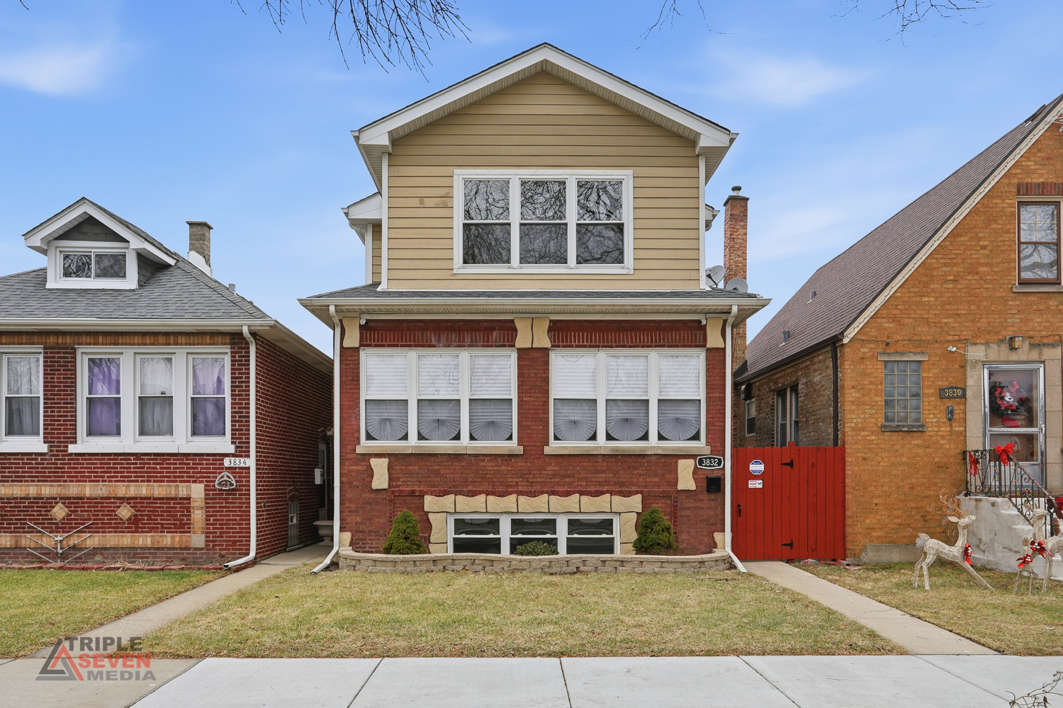 3832 West 64th Place Chicago, IL 60629 - Photo 2 of 35 a front view of a house with a yard