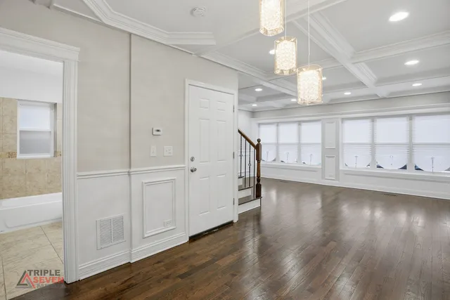 a view of a livingroom with wooden floor