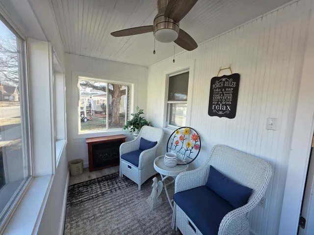 a living room with furniture and a window