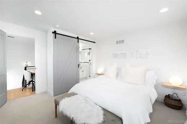 a bedroom with a bed and a table in it