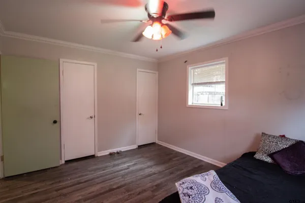 a bedroom with bed and a window