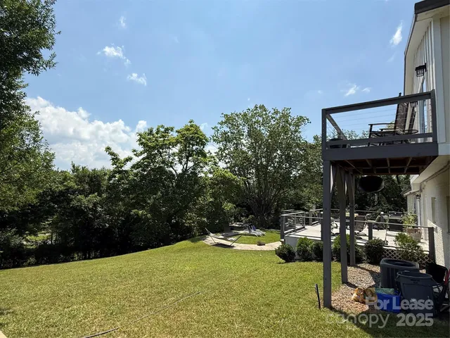 a view of yard with an outdoor seating