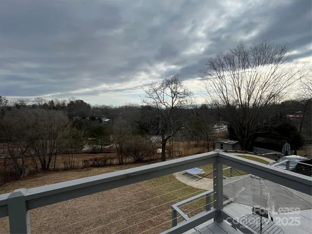 a view of a swimming pool with a yard