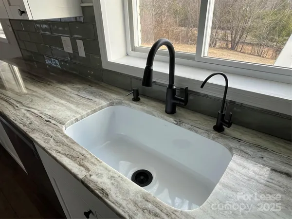 a close view of a sink a counter and a sink