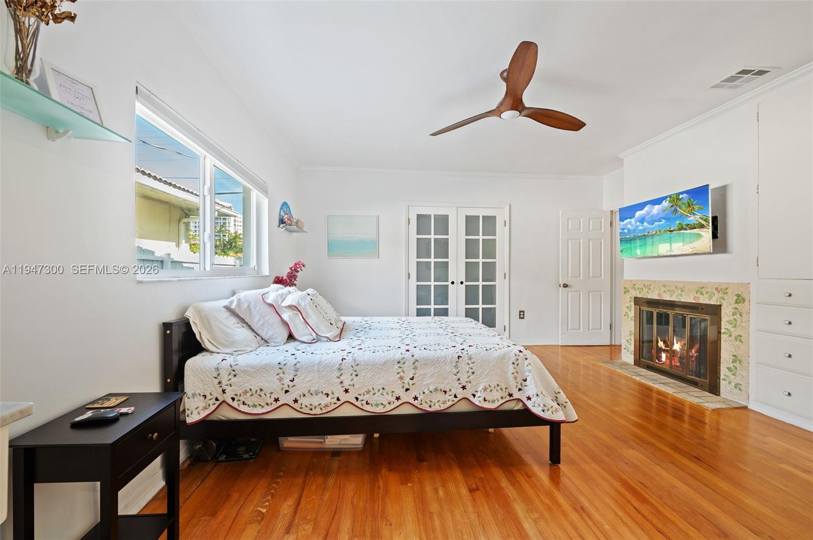 9280 Abbott Avenue Surfside, FL 33154 - Photo 22 of 40 Bedroom with fire place