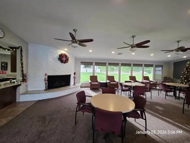 a kitchen with a refrigerator and a stove top oven