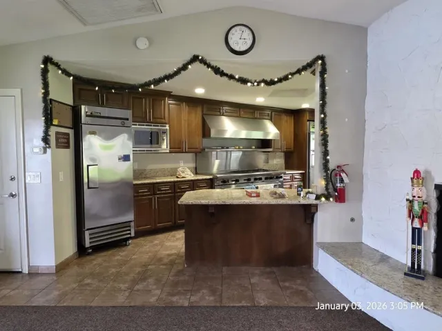 a view of a house with backyard porch and sitting area