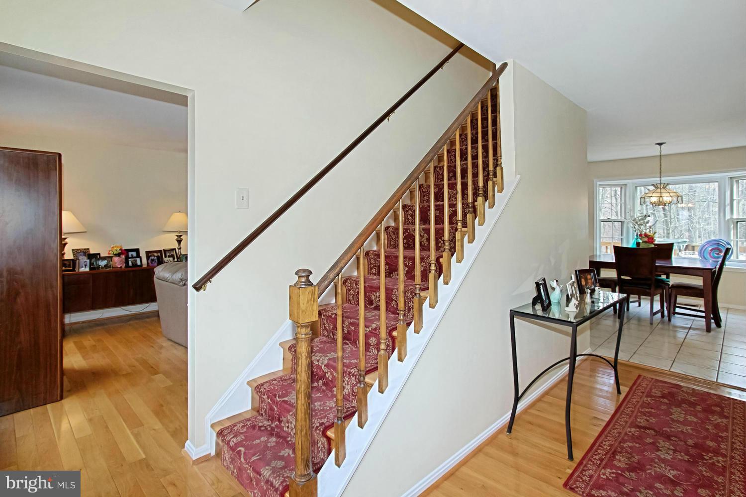 10714 Cross School Road Reston, VA 20191 - Photo 12 of 27 a view of a livingroom with furniture staircase and a living room