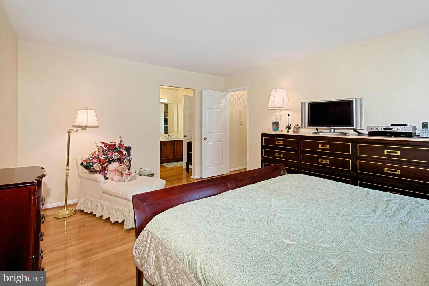 10714 Cross School Road Reston, VA 20191 - Photo 14 of 27 a bedroom with a bed and dresser