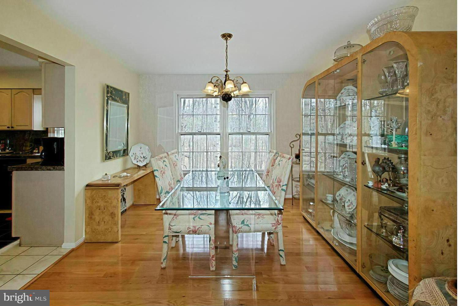 10714 Cross School Road Reston, VA 20191 - Photo 15 of 27 a dining room with furniture and wooden floor