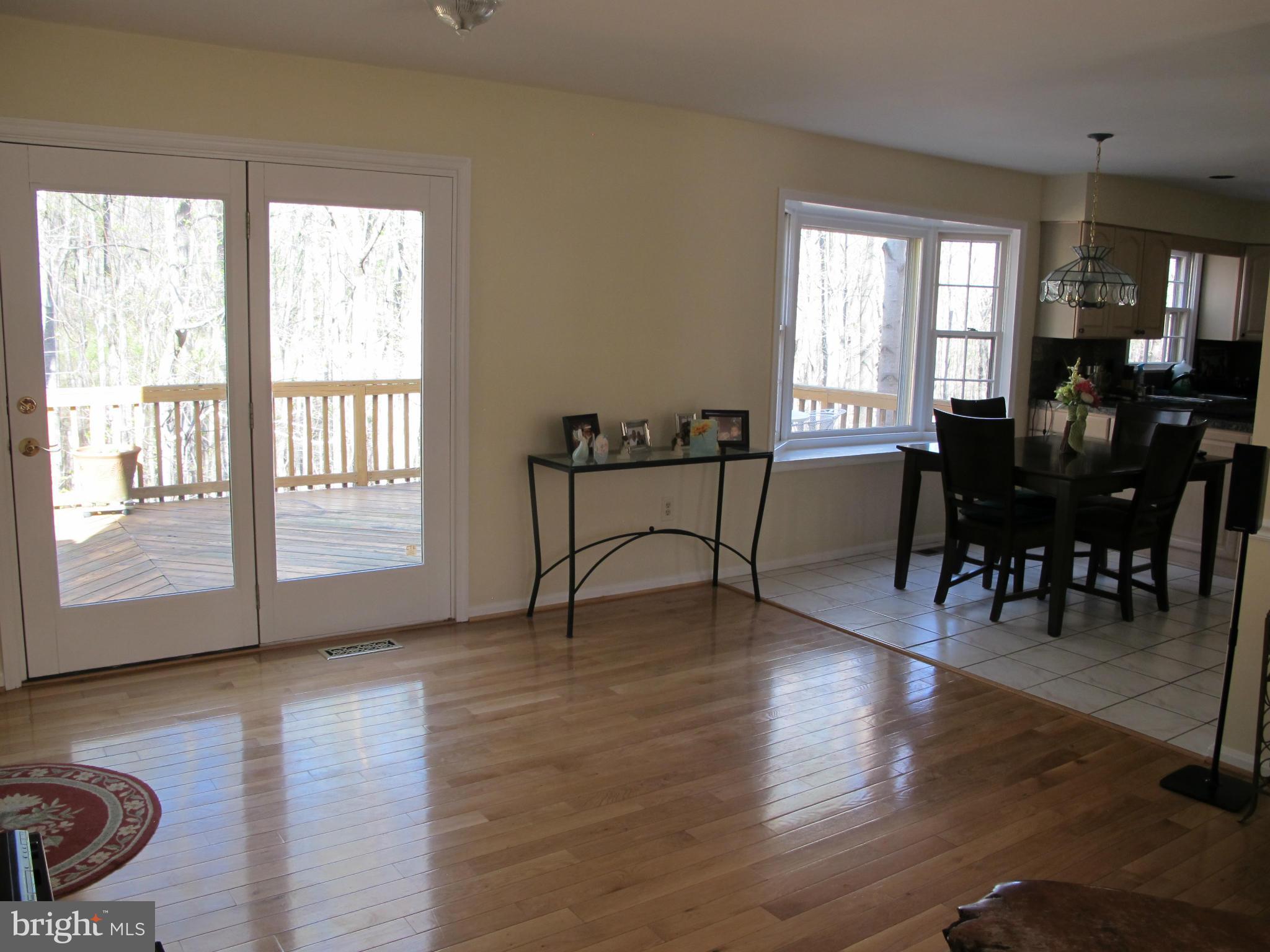 10714 Cross School Road Reston, VA 20191 - Photo 16 of 27 a view of a livingroom with furniture window and wooden floor