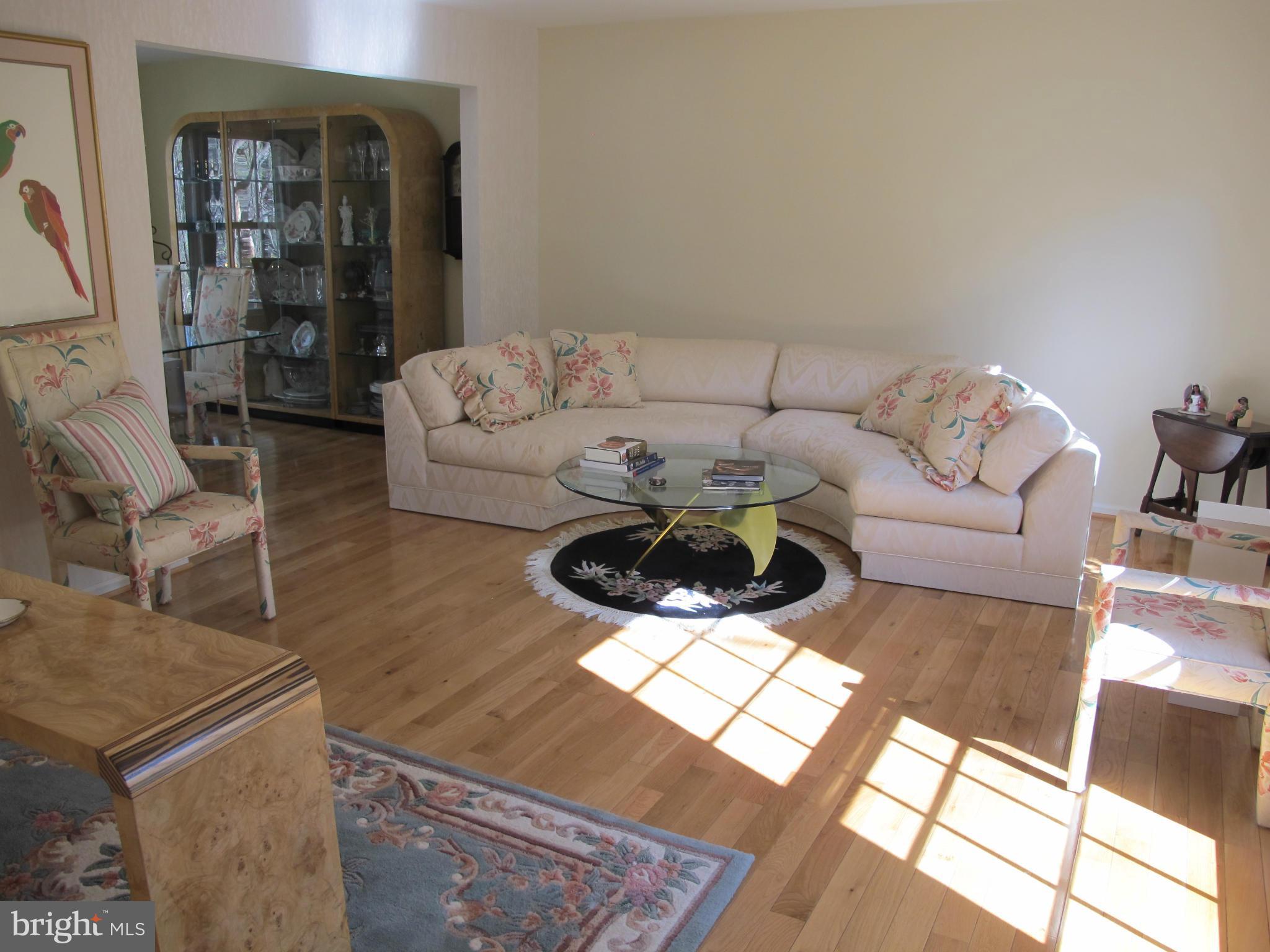 10714 Cross School Road Reston, VA 20191 - Photo 18 of 27 a living room with furniture and wooden floor