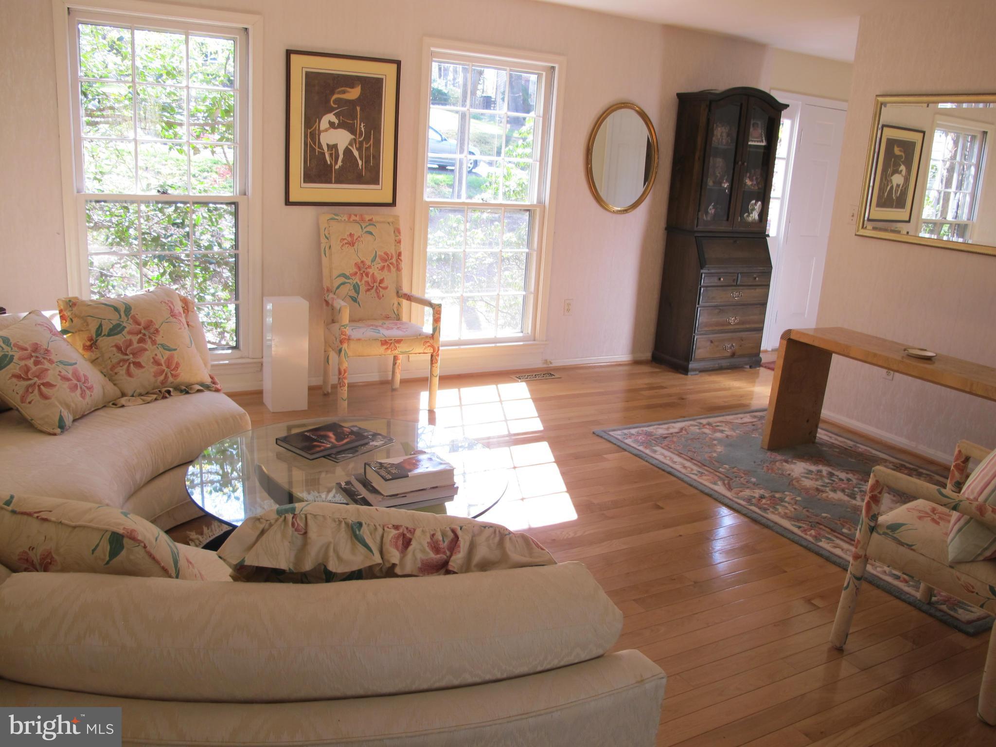 10714 Cross School Road Reston, VA 20191 - Photo 3 of 27 a living room with furniture and a window