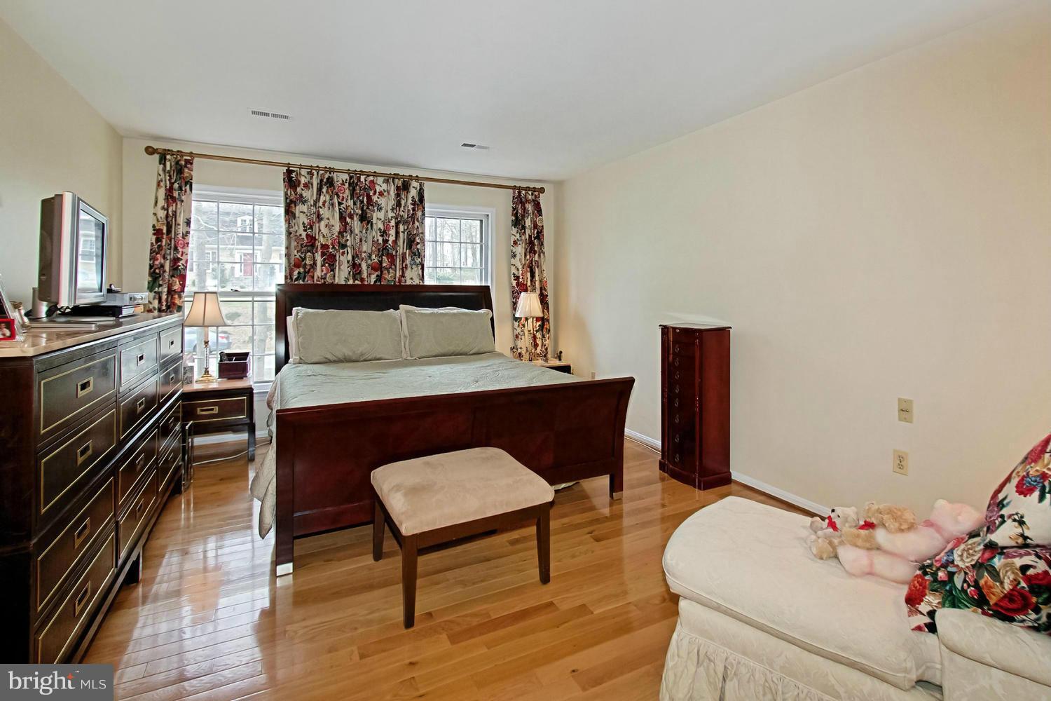 10714 Cross School Road Reston, VA 20191 - Photo 5 of 27 a living room with furniture and a floor to ceiling window