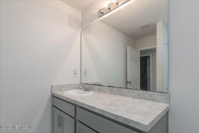 a bedroom with a large bed and a large window