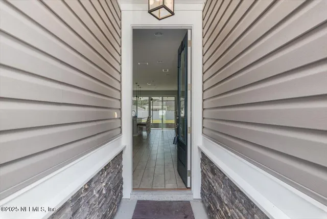 an empty room with closet and wooden floor
