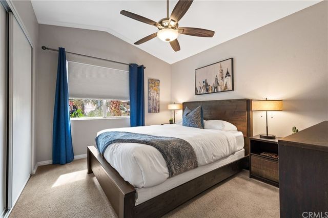 a bed room with a bed and a painting