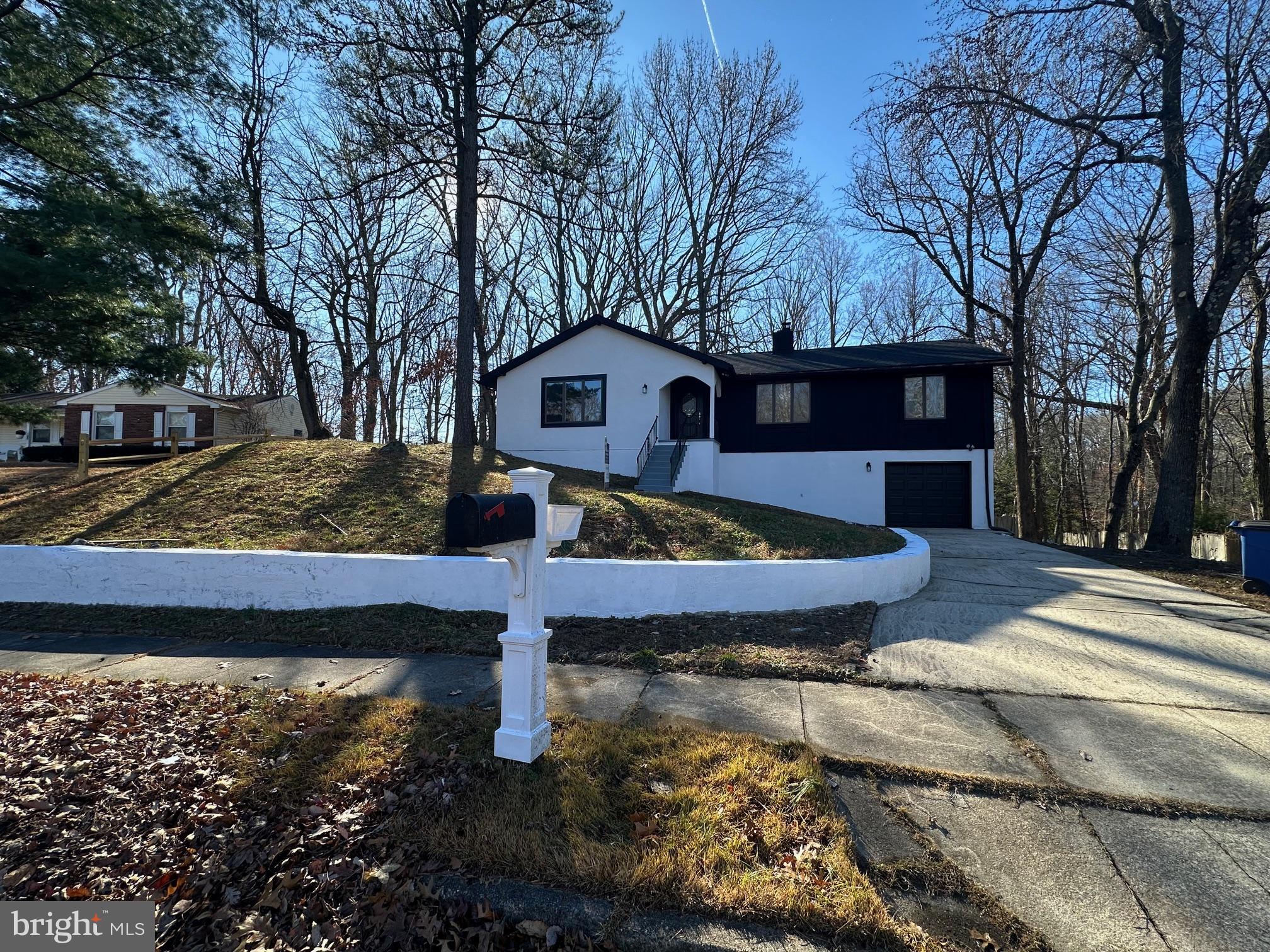 a view of a house with a yard covered with snow