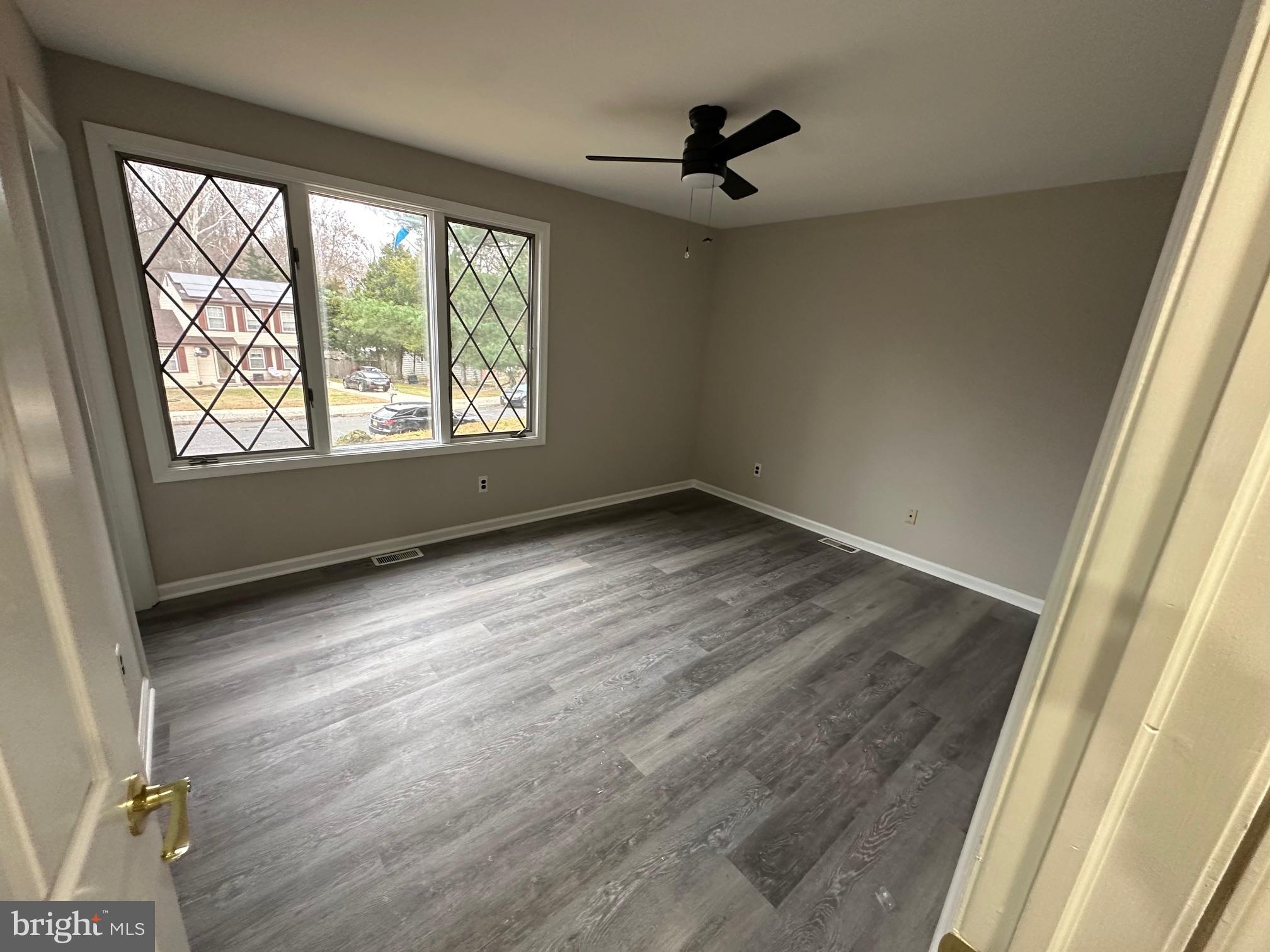 26 Sherri Way Clementon, NJ 08021 - Photo 17 of 37 wooden floor in an empty room with a window