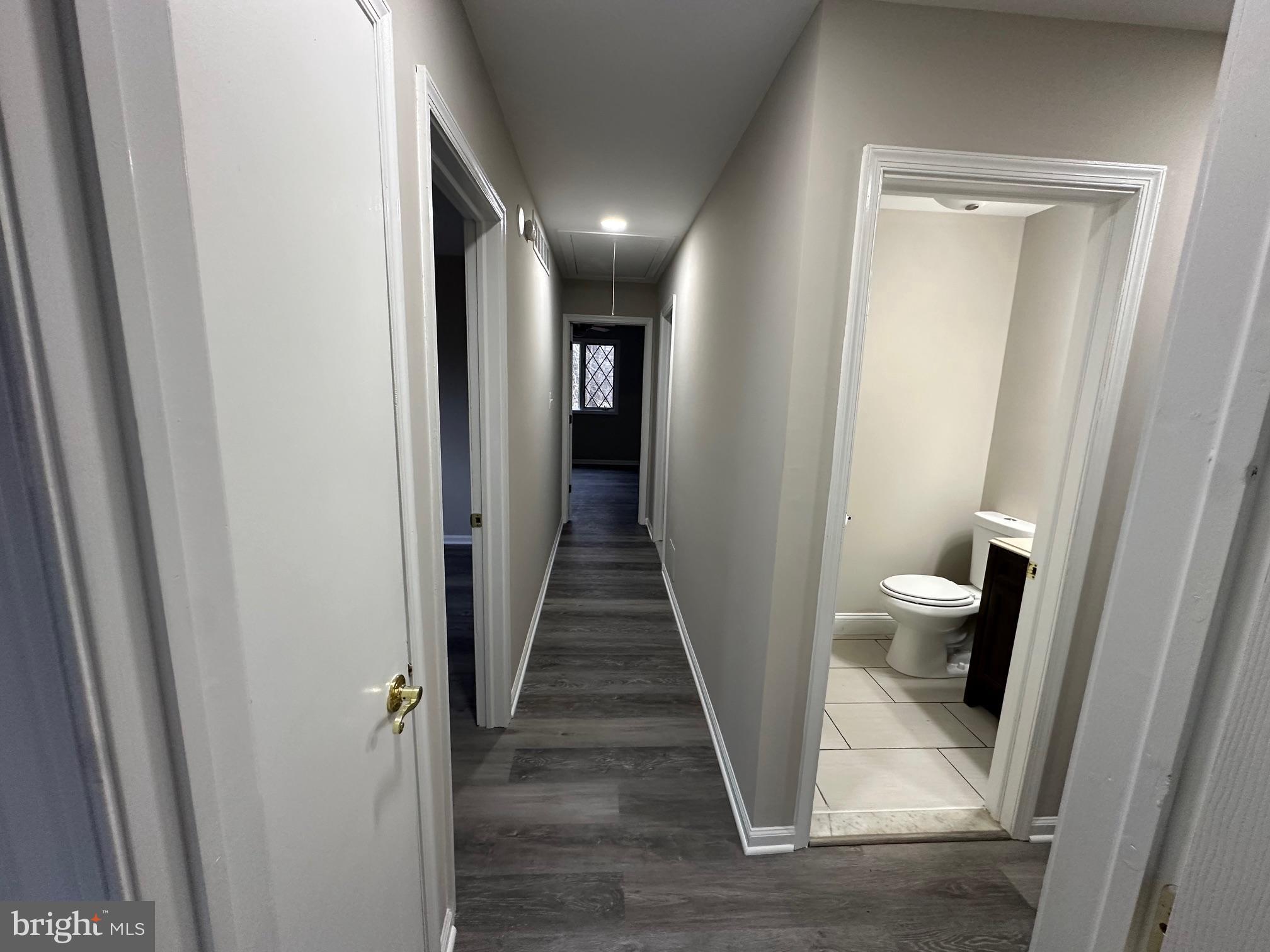 26 Sherri Way Clementon, NJ 08021 - Photo 19 of 37 a view of a hallway with white cabinets and wooden floor