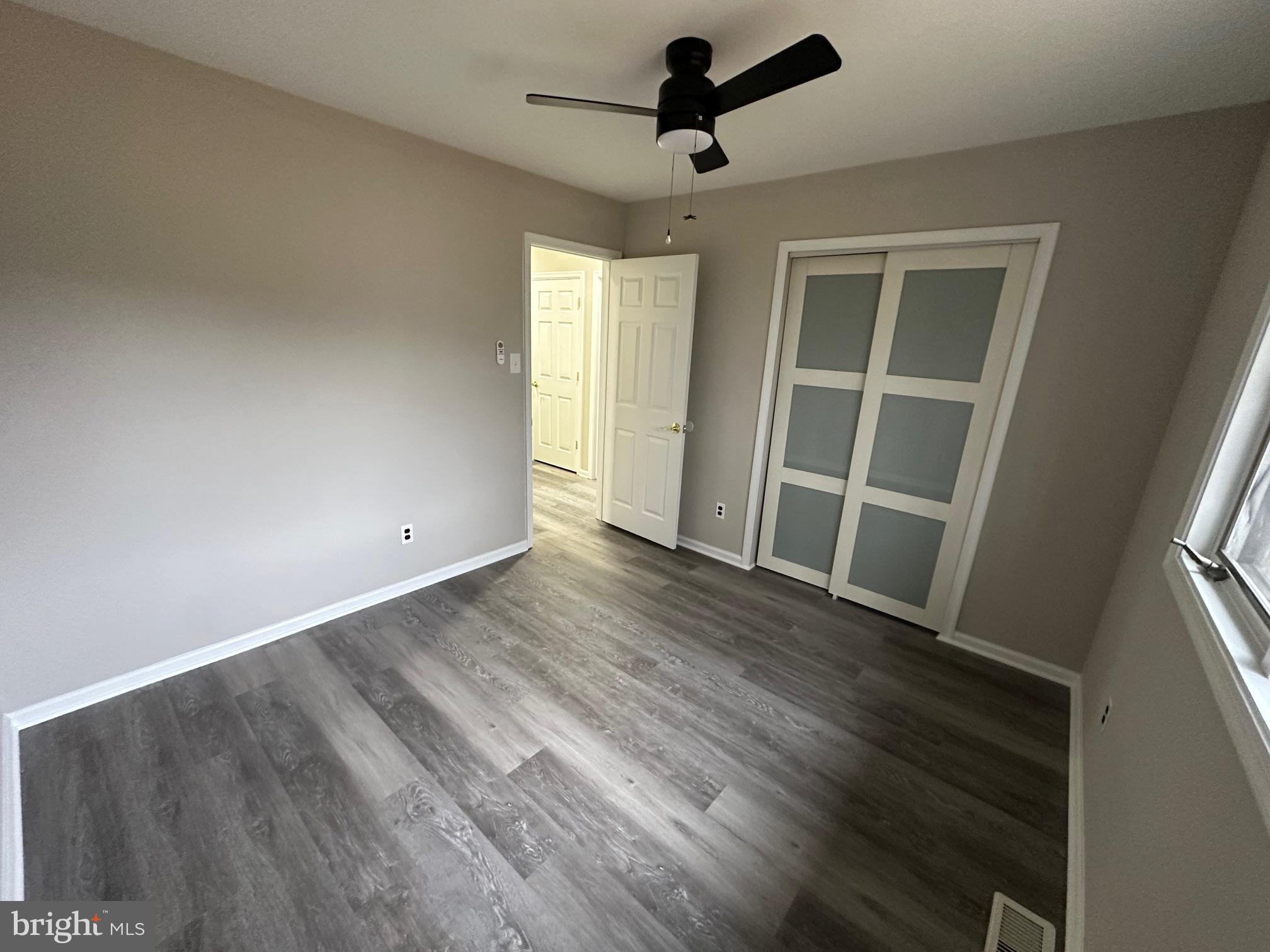 26 Sherri Way Clementon, NJ 08021 - Photo 21 of 37 wooden floor in an empty room with a window