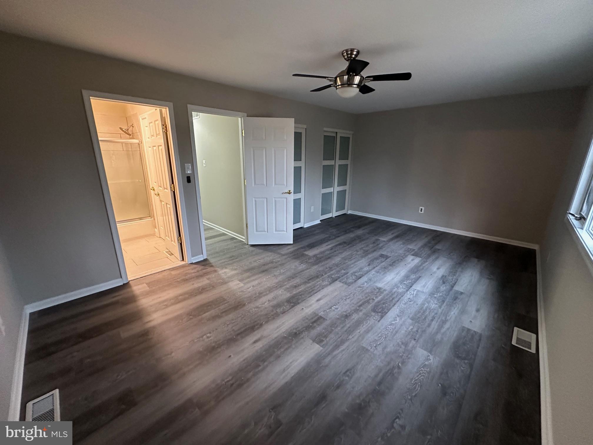 26 Sherri Way Clementon, NJ 08021 - Photo 24 of 37 an empty room with wooden floor and windows