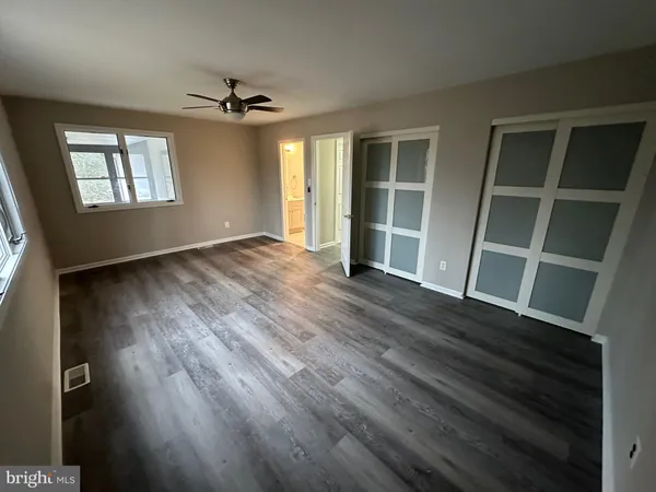 a view of entryway with wooden floor