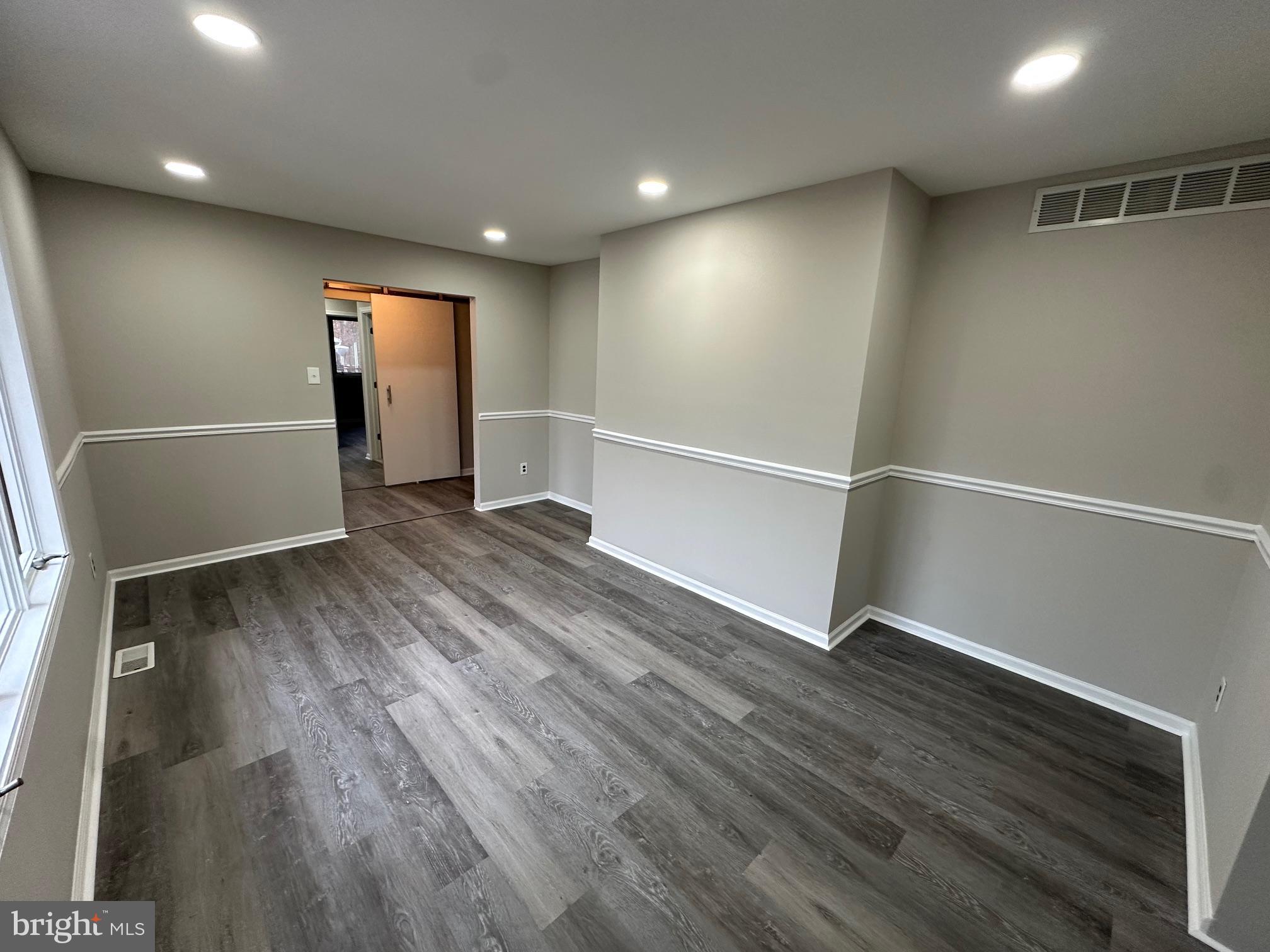 26 Sherri Way Clementon, NJ 08021 - Photo 28 of 37 an empty room with wooden floor and windows