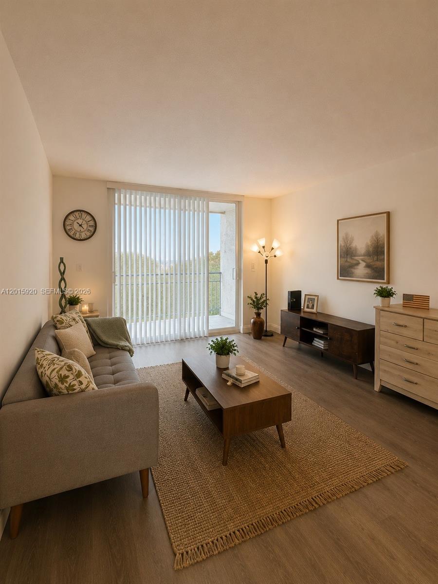 14170 Southwest 84th Street, Unit 404F Miami, FL 33183 - Photo 4 of 18 a living room with furniture and a window
