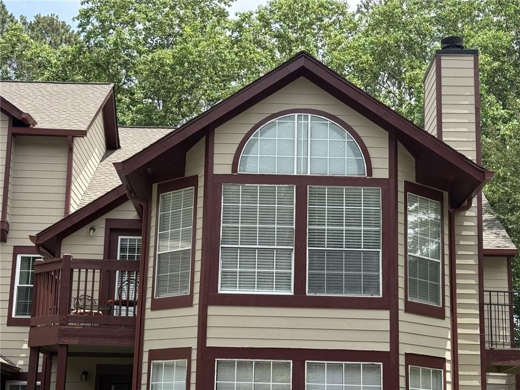 105 Hawkstone Way Alpharetta, GA 30022 - Photo 2 of 23 a front view of a house with a yard