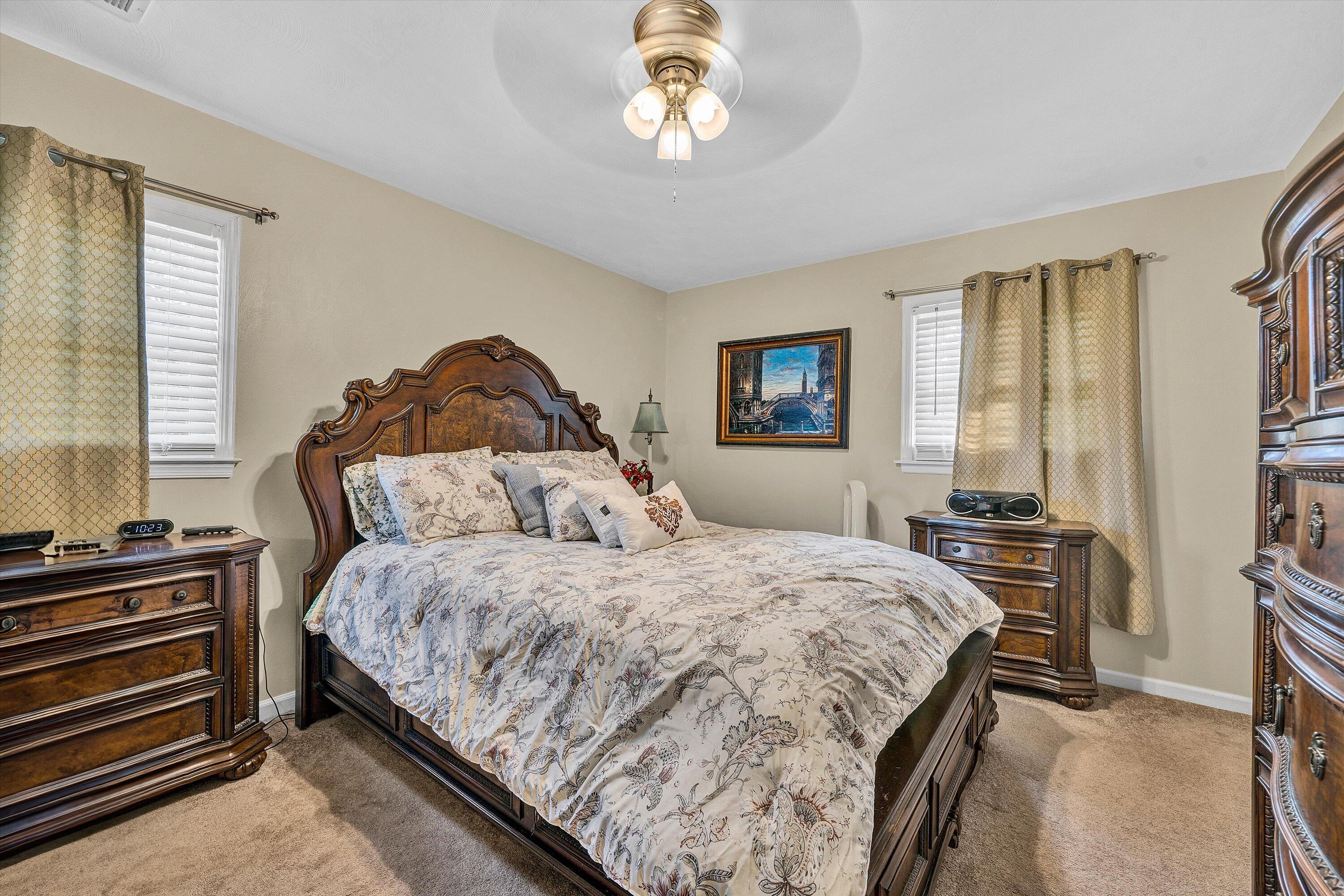 3876 Shingle Block Road Bedford, VA 24523 - Photo 13 of 29 a bedroom with a bed and a chandelier