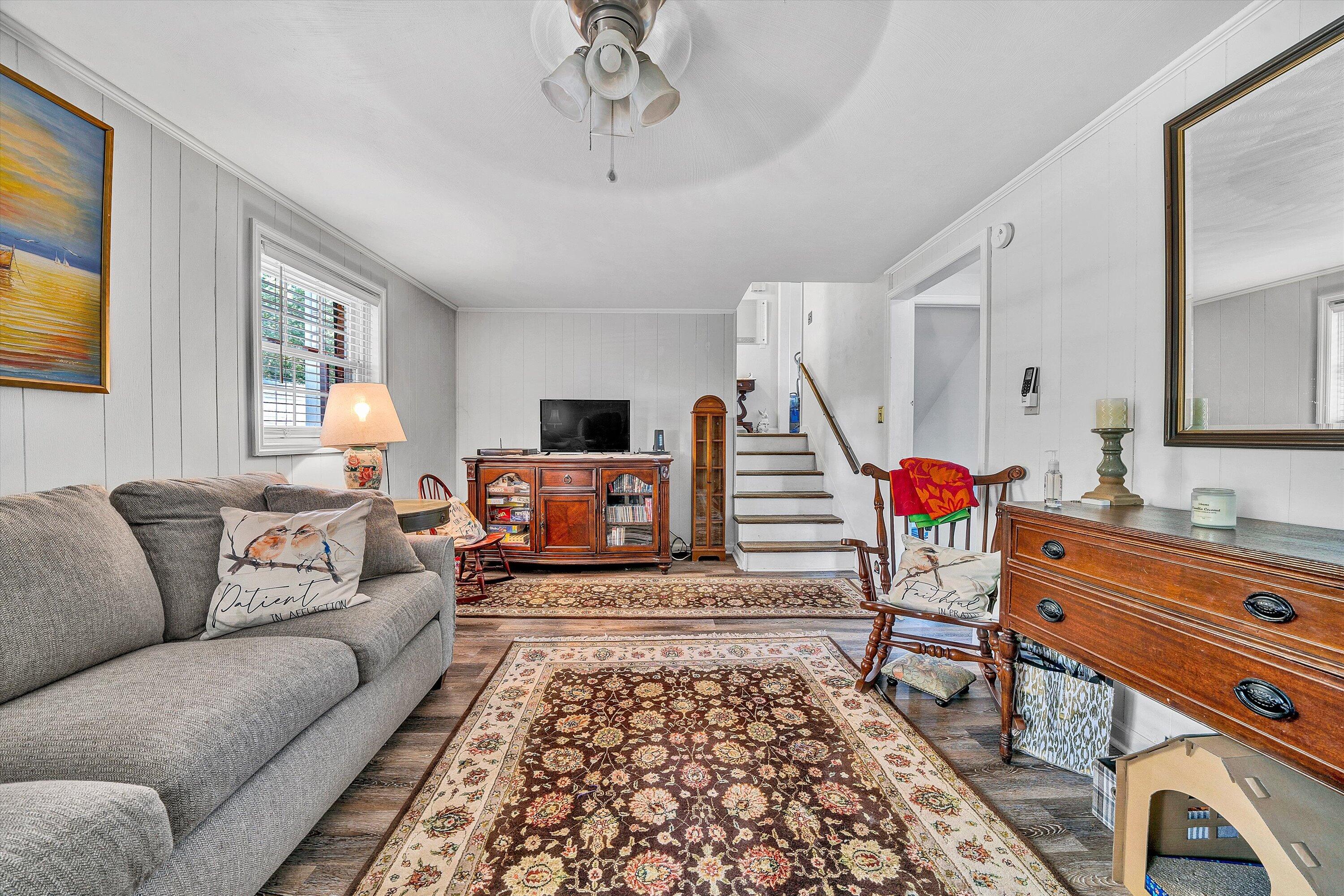 3876 Shingle Block Road Bedford, VA 24523 - Photo 21 of 29 a living room with furniture a fireplace and a flat screen tv