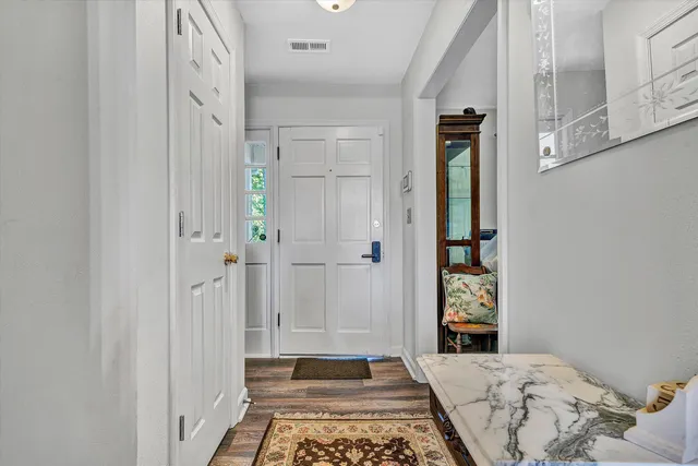 a bedroom with a bed and a rug