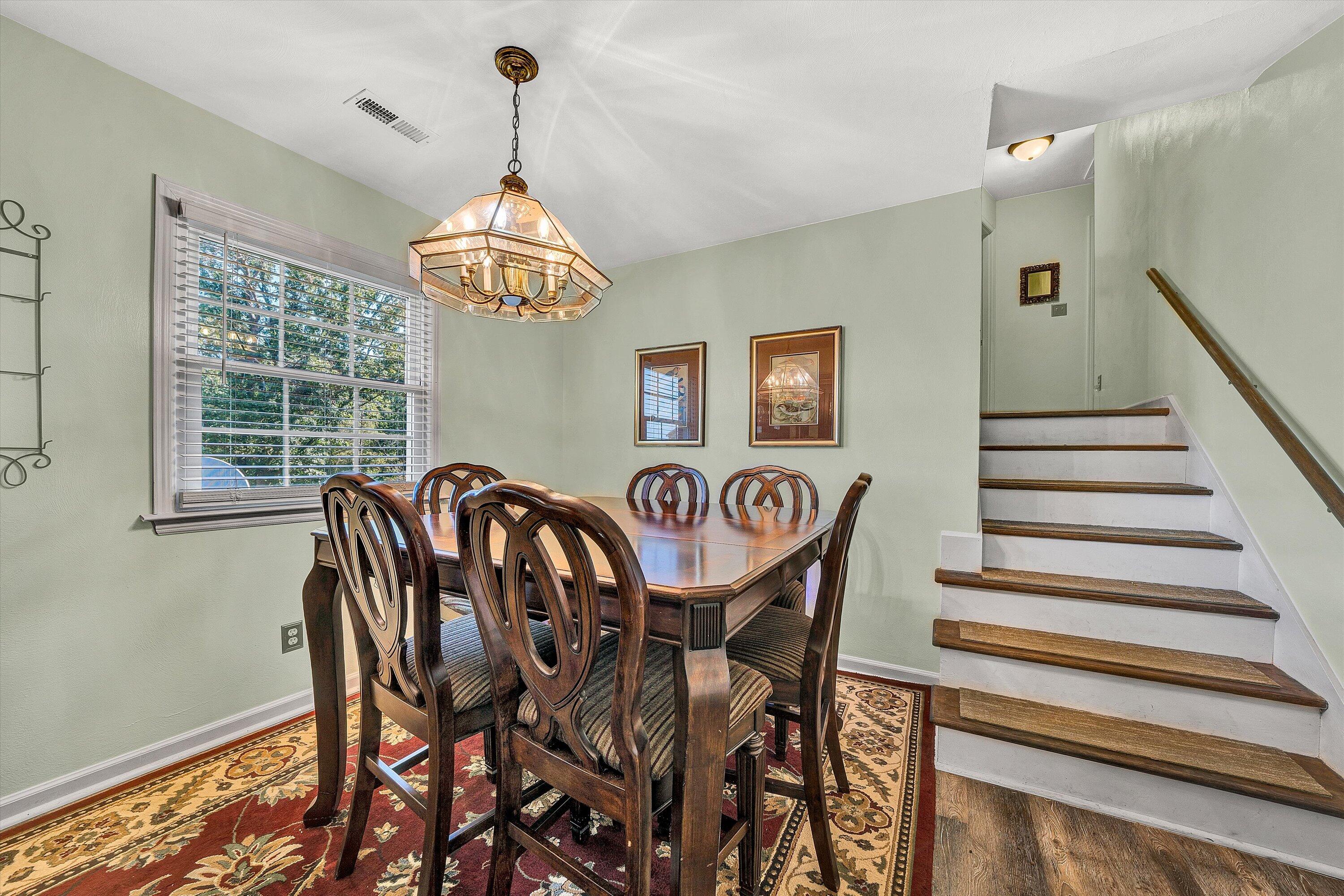 3876 Shingle Block Road Bedford, VA 24523 - Photo 6 of 29 a view of a dining room with furniture wooden floor and chandelier