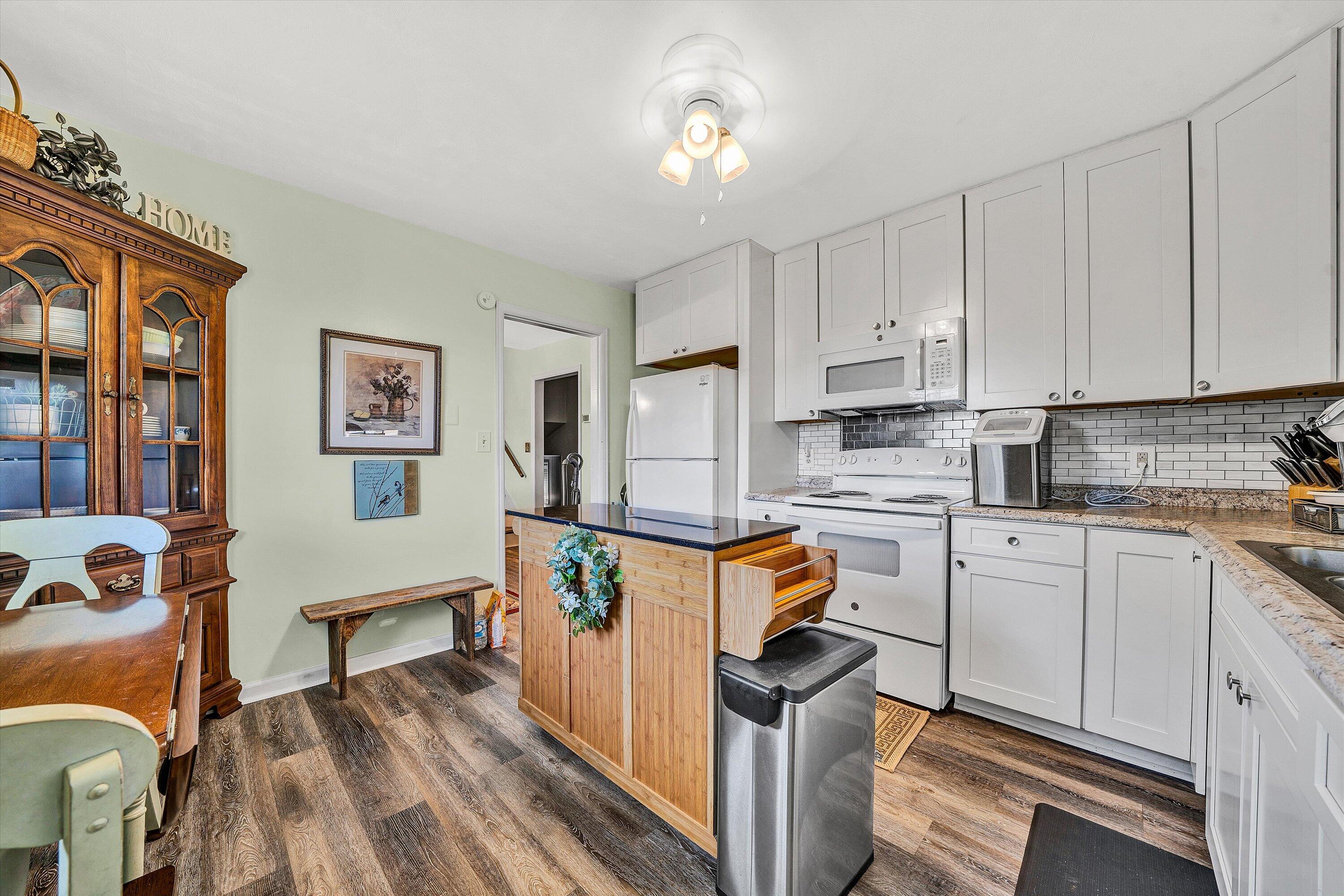 3876 Shingle Block Road Bedford, VA 24523 - Photo 9 of 29 a kitchen with stainless steel appliances granite countertop a stove refrigerator sink and cabinets
