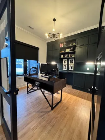 a view of a workspace with furniture