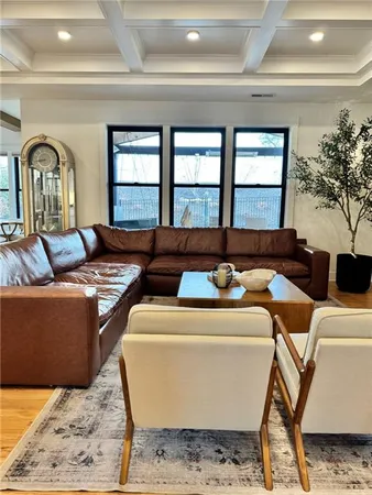a living room with furniture and a rug