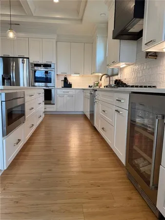 a kitchen with a dining table and chairs