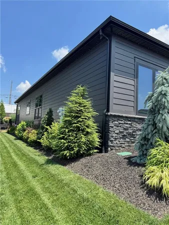 a front view of a house with garden