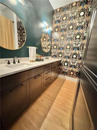 a living room with patio furniture and garden view