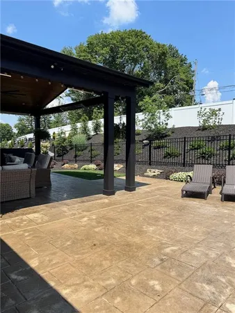 a view of a swimming pool with a patio