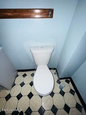 30 Danforth Avenue, Unit 2 Pittsfield, MA 01201 - Photo 7 of 12 a bathroom with a sink mirror and toilet