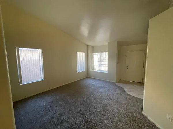 a view of empty room with windows