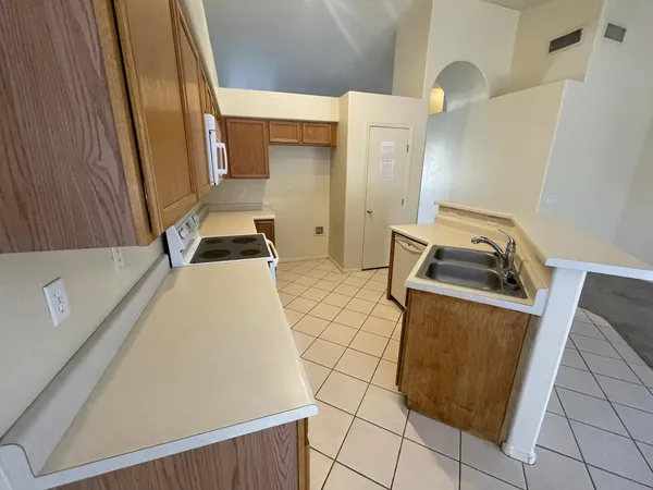 a bedroom with a bed and cabinets