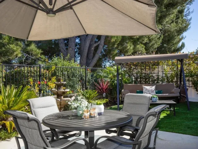 a outdoor dining space with furniture and outdoor view